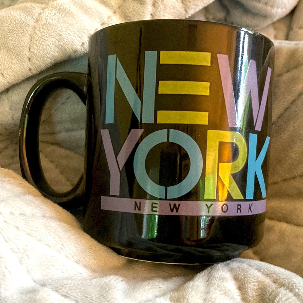 New York Black Mug ceramic. Block letters teal purple olive.